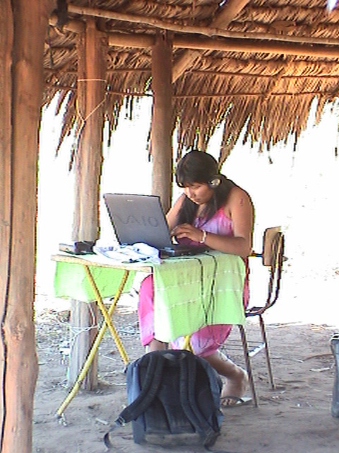 An Awetí co-worker with the community laptop