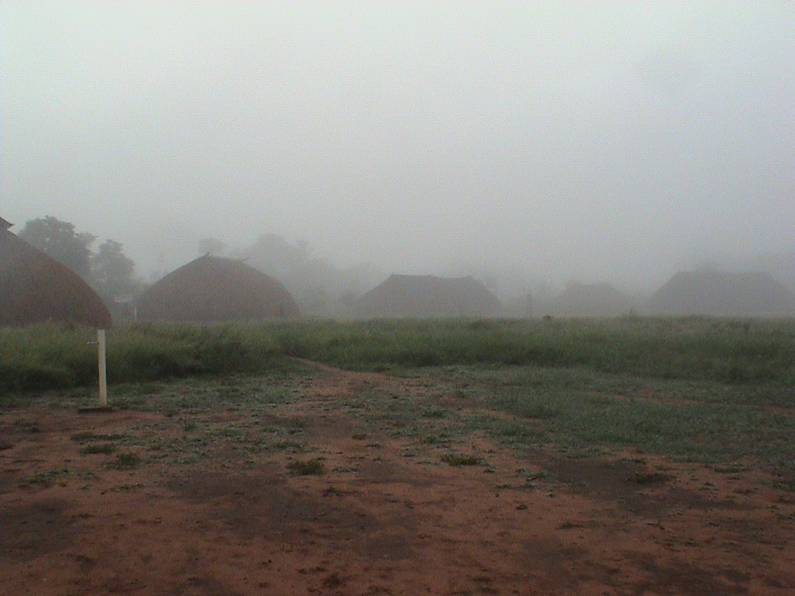 Part of the circle of houses around the central plaza, with early fog during the rainy season