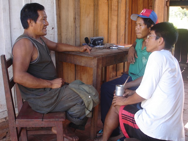 Man talking to two boys