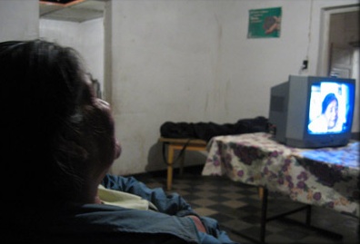 Angela Sistale at home watching a video of herself being interviewed. Qom Kayaripi community, CalchaquÌ, province of Santa Fe.